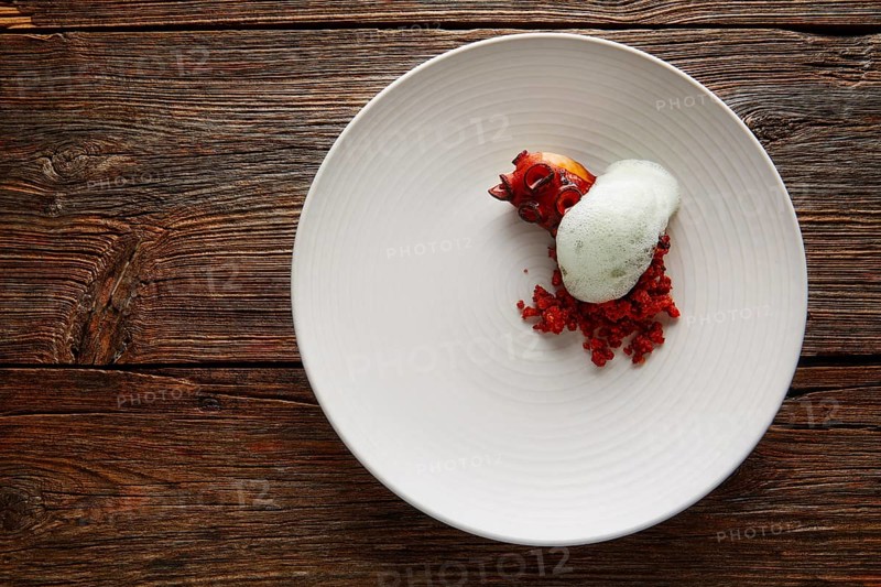 Grilled octopus with parsley air foam served with crunchy chorizo sausage