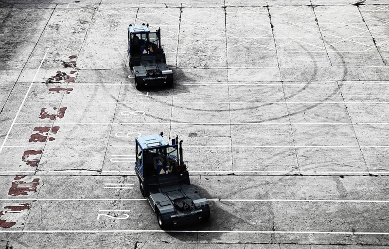 Loading lorry tractors in the port of Newcastle after work in the car park in front of the ferry