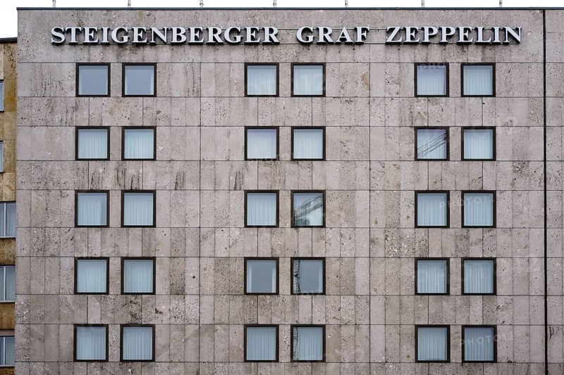 Stuttgart, Germany - February 03, 2018: The striking façade with square rows of windows of the Steigenberger Graf Zeppelin luxury hotel in Stuttgart on 03 February 2018