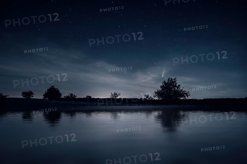 An image of a night scenery with comet Neowise