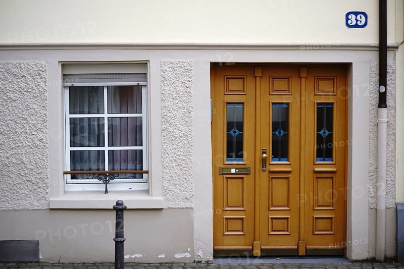 The entrance to an old town flat with very low ceilings and a window