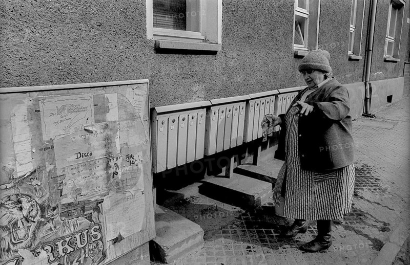 Germany, Wolfen, 31.03.1992, Street, Woman cleaning lockers, Europe