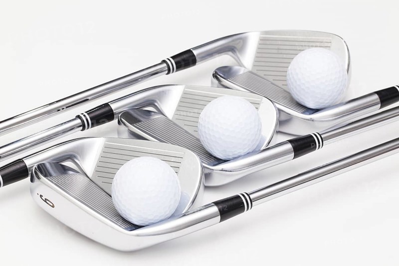 Titanium golf clubs on the white background