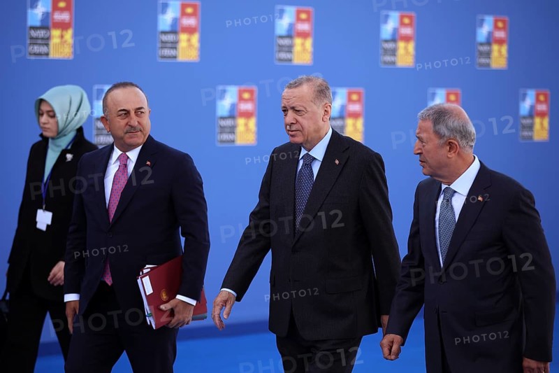 Spain, Madrid - 30 June, 2022: Turkish President Recep Tayyip Erdogan (C) and Turkish Foreign Minister Mevlut Cavusoglu (L) attend the NATO summit in Madrid, Spain, Europe