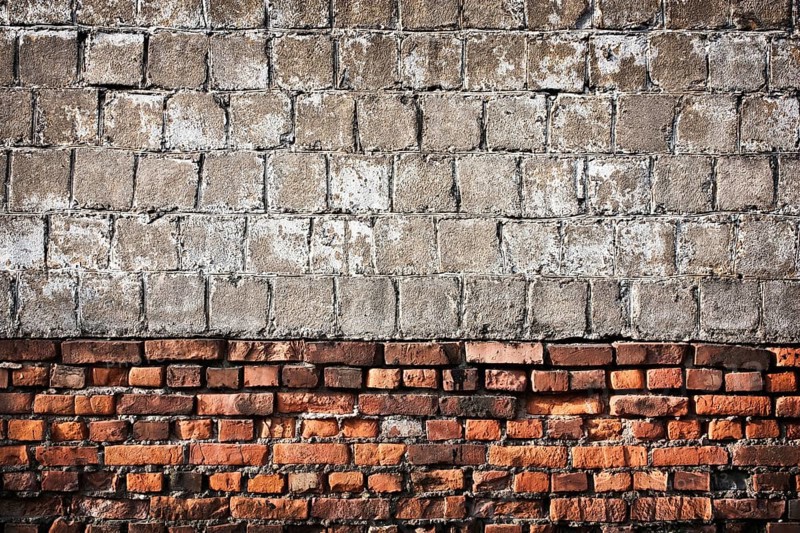 Vintage brick and concrete wall as background