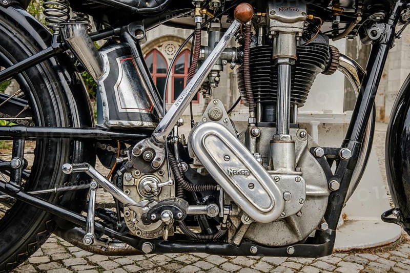 Lisbon, Portugal - Oct 15, 2023: Close-up of engine area of iconic Norton ES2 motorcycle by Norton Motors Ltd, Aston, Birmingham, parked on cobblestone road. Reliable and very popular long stroke single of traditional design