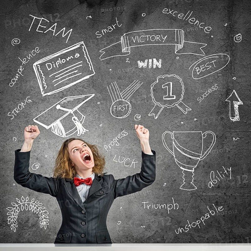 Young woman with disheveled hair against blackboard background