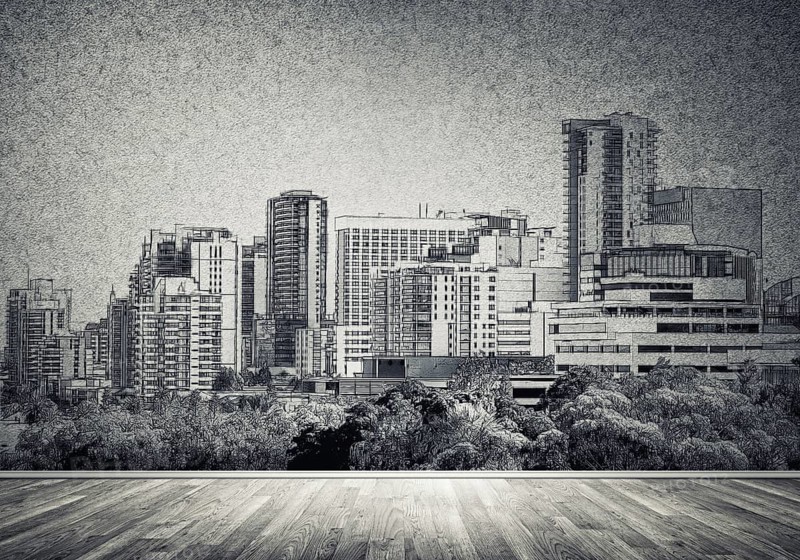 Silhouette of modern city landscape drawn on concrete wall