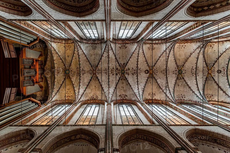 Lubeck, Germany, August 3, 2019: Directly below view of the vaults of St. Mary Church in Lubeck, Europe