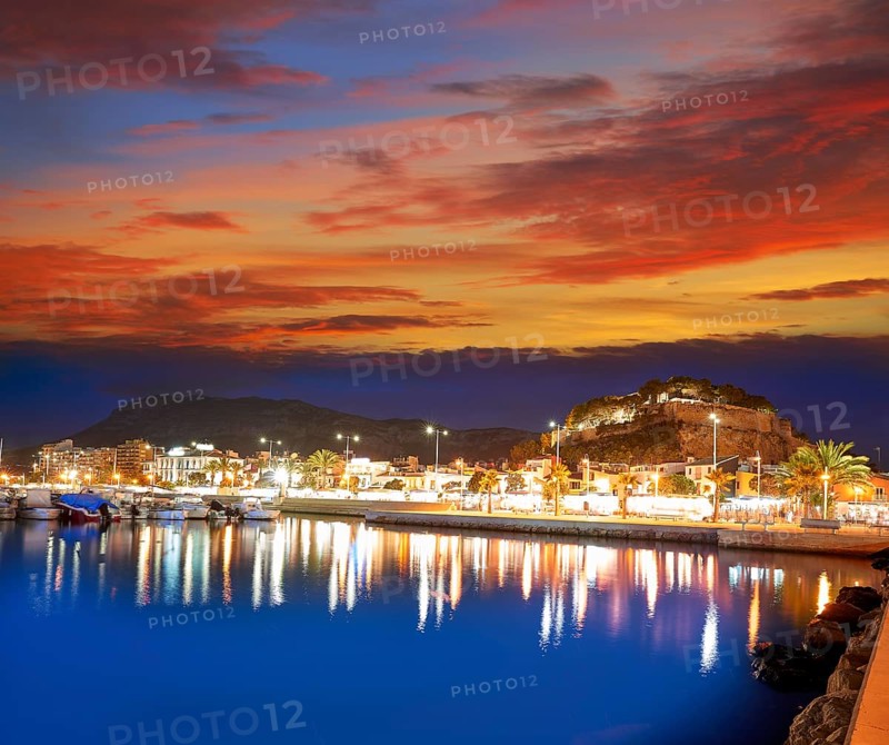 Denia sunset with castle and marina at Alicante in Spain