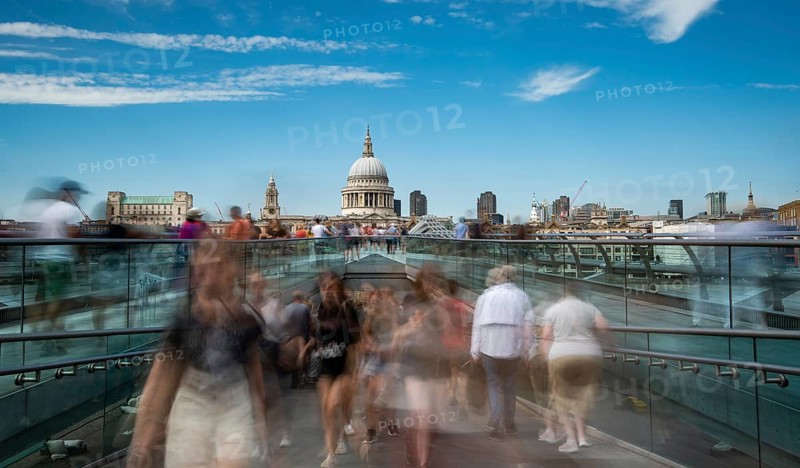 London, UK, July 5, 2019: People walking on the millennium bridge and Saint Paul Cathedral in London UK