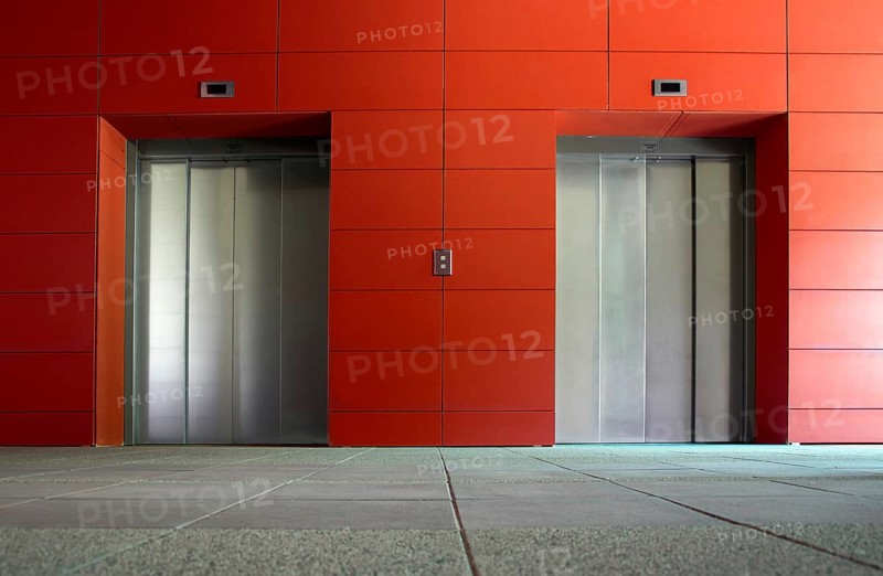 Two elevator doors in a luxurious building