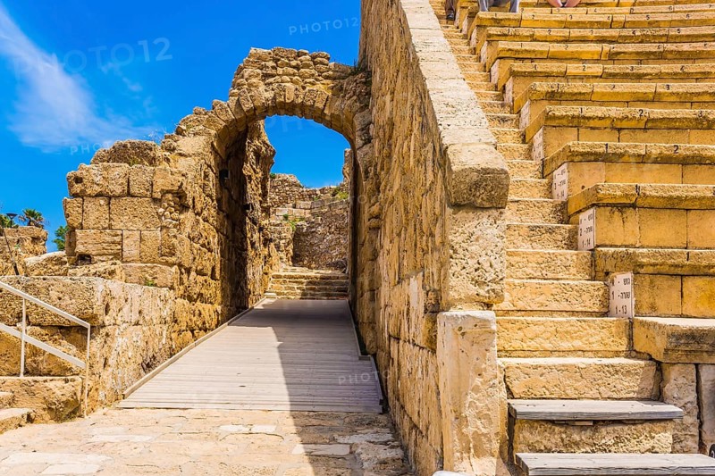 The fragment of protective walls. The oldest amphitheater in Israel. Ruins of the ancient city of Caesarea. Concept of archeological and historical tourism