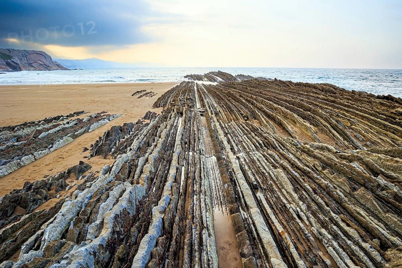 Basque country. Magical unique landscape. Flysch - unique landscape of underwater rocks exposed at low tide. The most unusual beach in the Basque Country - Itsurun