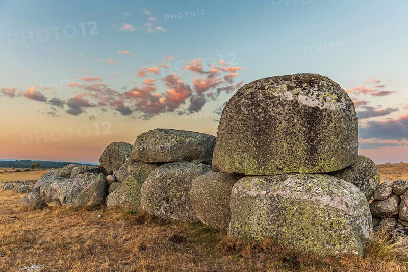 Rocks in the landscape at sunset. Aubrac, France, Europe