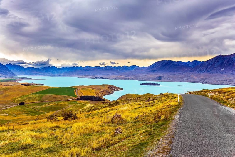 New Zealand, South Island. Lake Tekapo on cloudy day. The lake in the mountains. Travel to a faraway country. The concept of active, exotic and photo tourism, Oceania