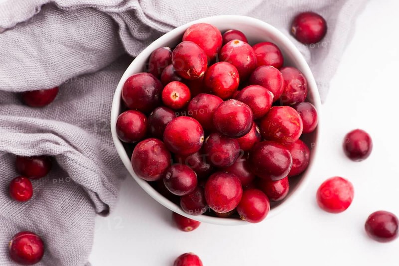 Ceramic bowl of Cranberry on white background