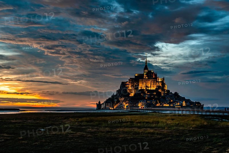 Dramatic sunset on Mont Saint Michel, Normandy, France, Europe