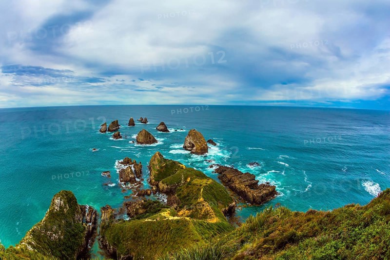 Nuggets Point is a landmark relief on the Otago coast, surrounded by rocky islets. Travel to New Zealand. The concept of active, eco and photo tourism