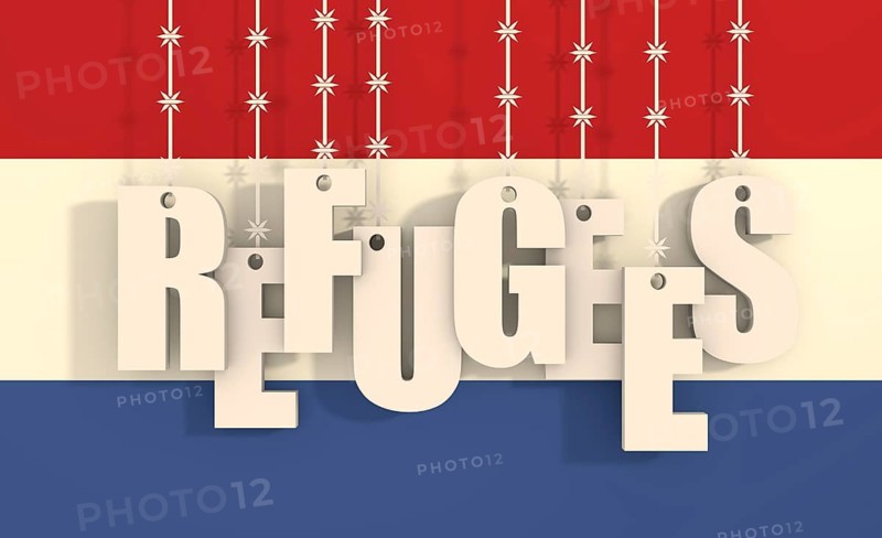 Image relative to migration from africa to european union. Refugees text hanging by barbed wire. Netherlands flag background