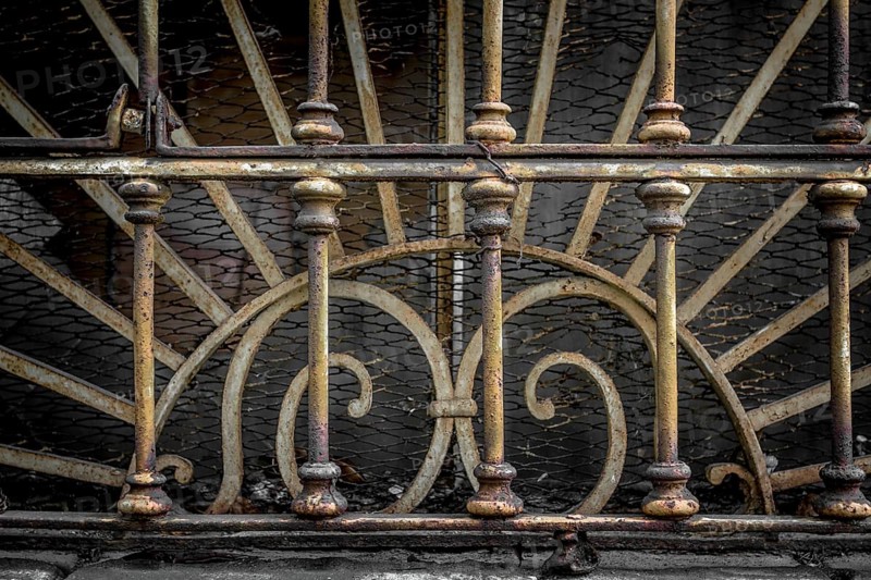 Decorations end 800 of an old Italian industrial railing