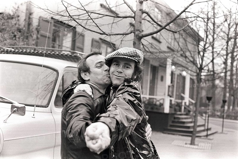 Elton John. English singer, songwriter born march 25 1947. Pictured wearing a chequered cap and a matching chequered scarf during a visit to Sweden 1978. Kristoffersson