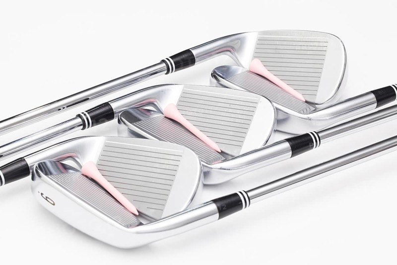 Titanium golf clubs on the white background