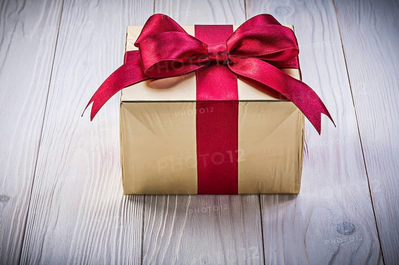 Birthday gift box on wooden board holidays concept