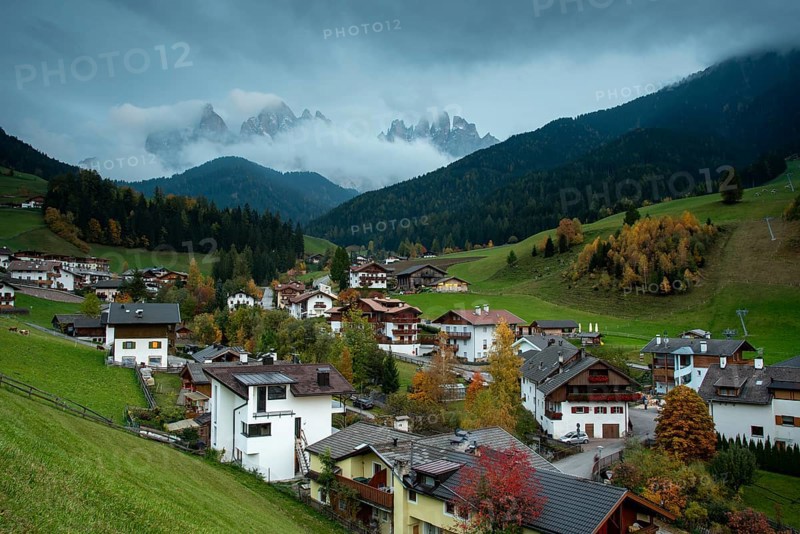 Picturesque village of Val di Funes with the dolomite rocky mountains in Italy at night