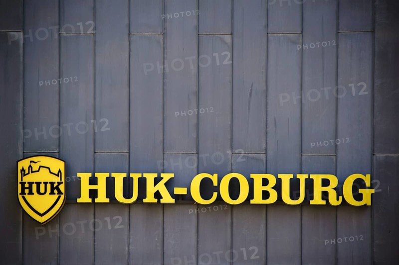 Mainz, Germany - July 06, 2017: The yellow company sign and logo of the insurance company HUK Coburg on a sheet metal facade of an office building on 06 July 2017 in Mainz