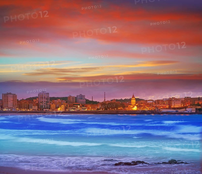 Gijon skyline sunset in San Lorenzo beach of Asturias in Spain