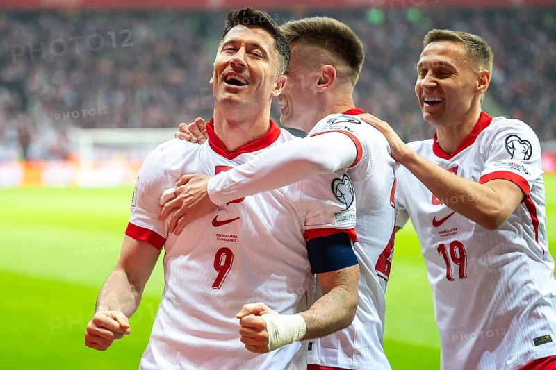 WARSAW, POLAND - MARCH 21, 2025: Qualifications for FIFA World Championship 2026. Match Poland - Lithuania 1:0. Joy Robert Lewandowski and Krzysztof Piatek, Przemyslaw Frankowski team of Poland after scoring goal