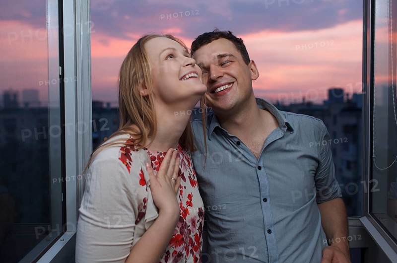 Playful young couple enjoying their new own apartment