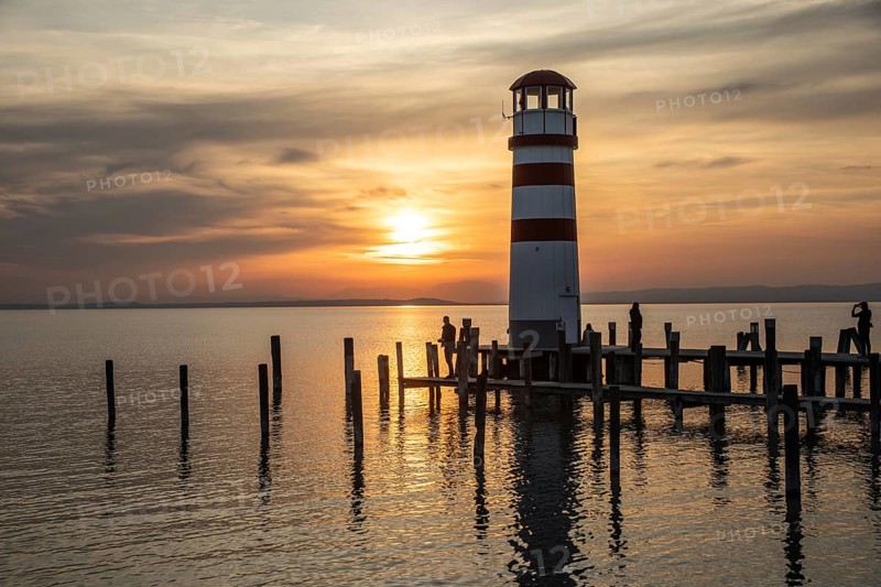 Footbridge to the lighthouse at sunset, Podersdorf am See, Lake Neusiedl, long exposure, Burgenland, Austria, Europe