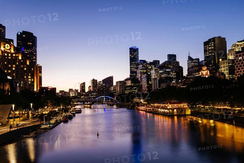 MELBOURNE, AUSTRALIA - OCTOBER 10, 2024: Melbourne skyline from Princes Bridge in Southbank along the Yarra River at dusk in Victoria, Australia, Oceania