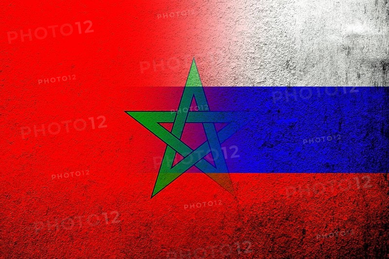 National flag of Russian Federation with The Kingdom of Morocco National flag. Grunge background