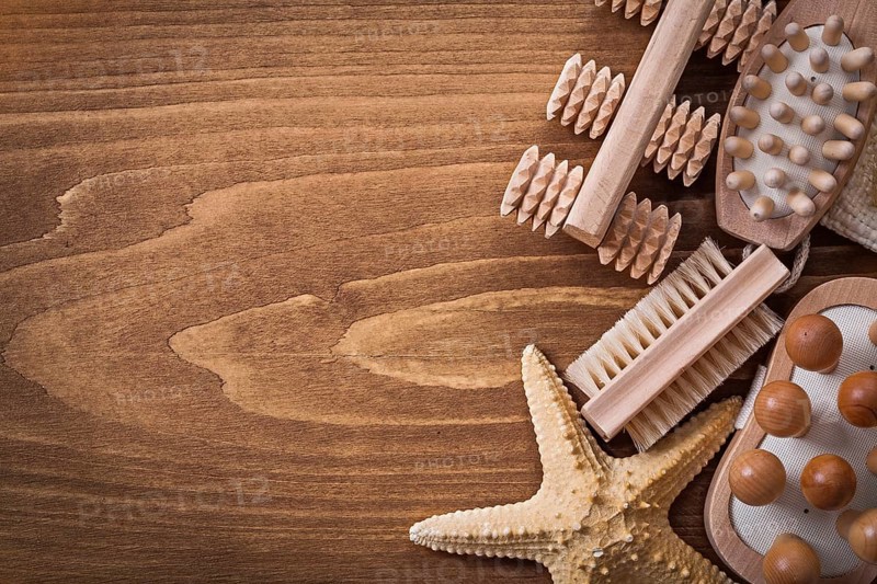 Wisp of bast back massagers starfish and brush on pine vintage board healthcare concept