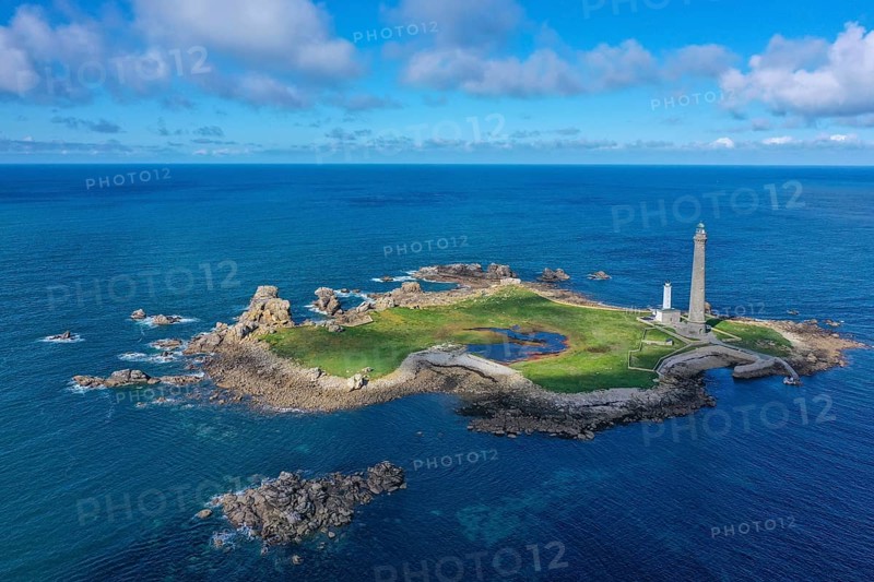 Aerial view island Ile Vierge with lighthouses Phare de l'Ile Vierge, old lighthouse from 1845 and new lighthouse from 1902, with 82, 5 metres highest lighthouse in Europe, off the coast of Plouguerneau, department Finistere Penn-ar-Bed, region Bretagne Breizh, France, Europe