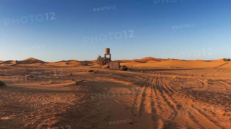View of offroad vehicle tracks leading into the sand dunes of Erg Chebbi in the Sahara Desert of Morocco