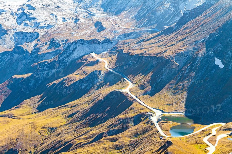 The mountain serpentine of the panoramic mountain road Grossglocknerstrasse. The Hohe Tauern Park. The slopes of the Austrian Alps are covered with colorful moss. Austria