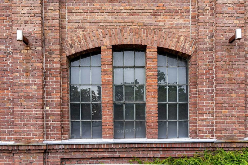 Windows of an 100 years old industrial brick building