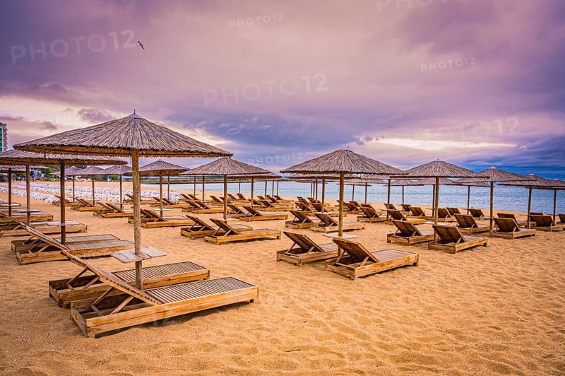 The beach has sunbeds and bamboo parasols and appears quiet and deserted when the sky is cloudy, Golden Sands, Varna, Bulgaria, Europe