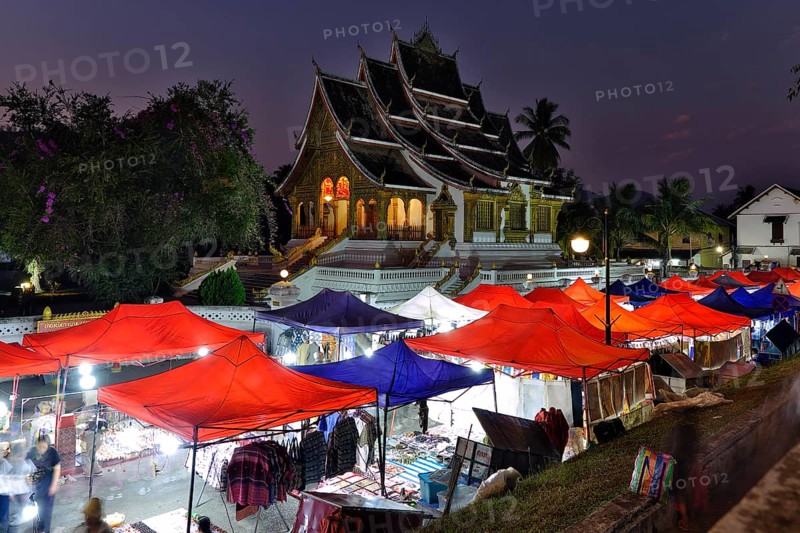 Night market in front of the Buddhist temple Haw Phra Bang of the Royal Palace, National Museum on Sisavangvong Road, Luang Prabang, Laos, Asia