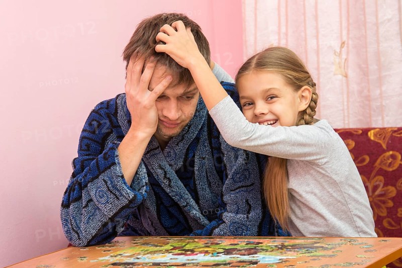 Daughter fun soothes tired dad who collect puzzles