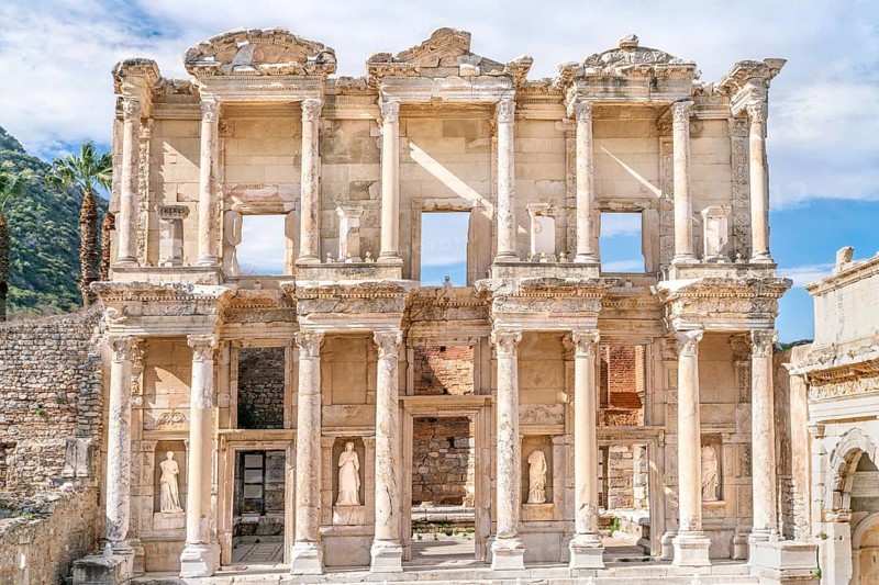 Celsus Library in Ephesus in Selcuk (Izmir), Turkey. Marble statue is Sophia, Goddess of Wisdom, at the Celcus Library at Ephesus, Turkey. The ruins of the ancient antique city