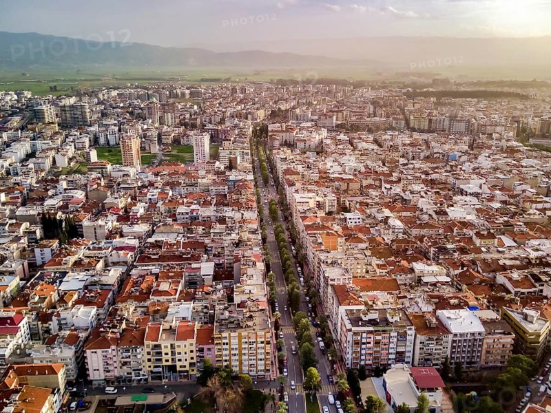 Aerial photograph of the capital of Aydin province - Aydin city from high point of drone fly in sunny day in Turkey. Amazing aerial cityscape view from birds fly altitude on beautiful city centre and parks