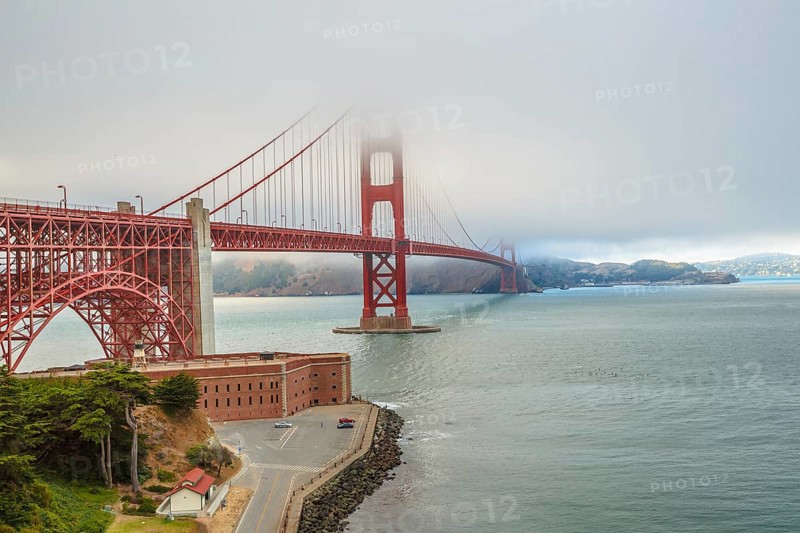 Aerial view of Golden Gate Bridge from Fort Point, south shore, symbol, icon and landmark of San Francisco, California, United States. Typical fog in summertime. Travel and holidays concept