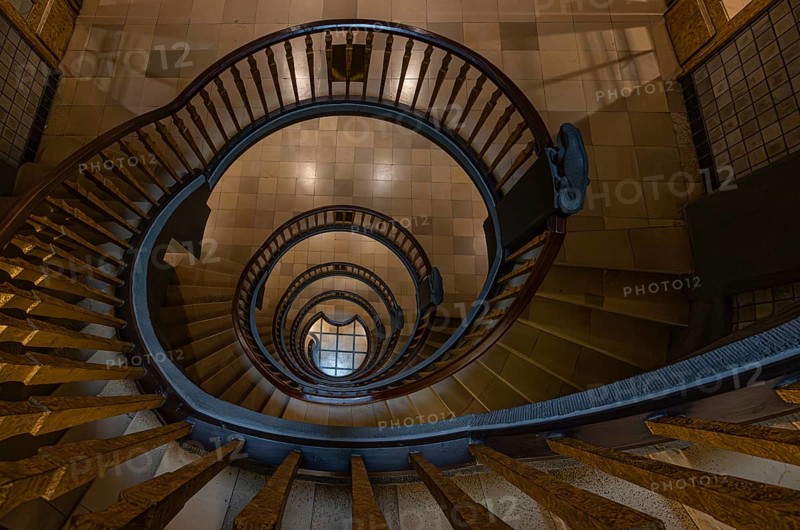 Elegant spiral staircase with wooden railing in a building, abstract view from above, Kontorhausviertel, Old Town Hamburg, Free and Hanseatic City of Hamburg, Germany, Europe