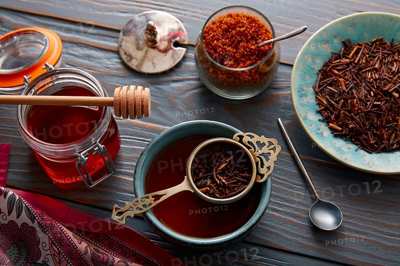 Kukicha tea served in bowl on wooden table board