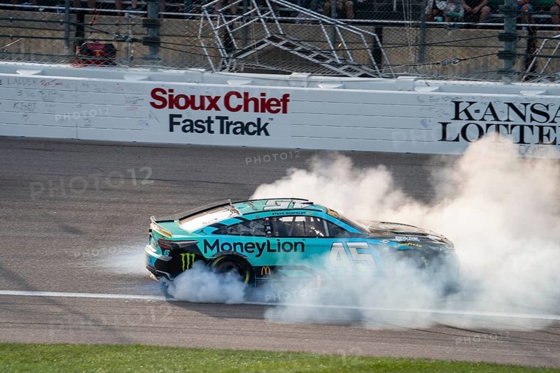 NASCAR Cup Series Driver Tyler Reddick (45) celebrates his win for the Hollywood Casino 400 at the Kansas Speedway in Kansas City KS